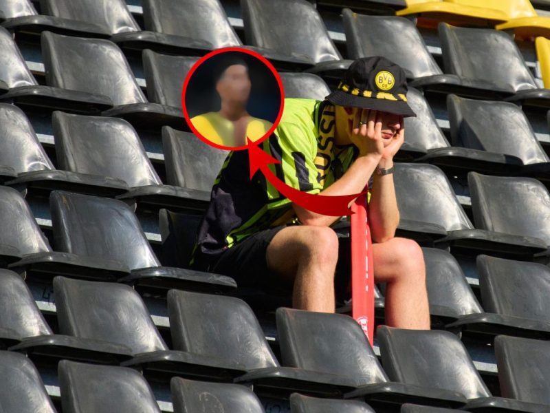 Die Fans von Borussia Dortmund schauen traurig drein.
